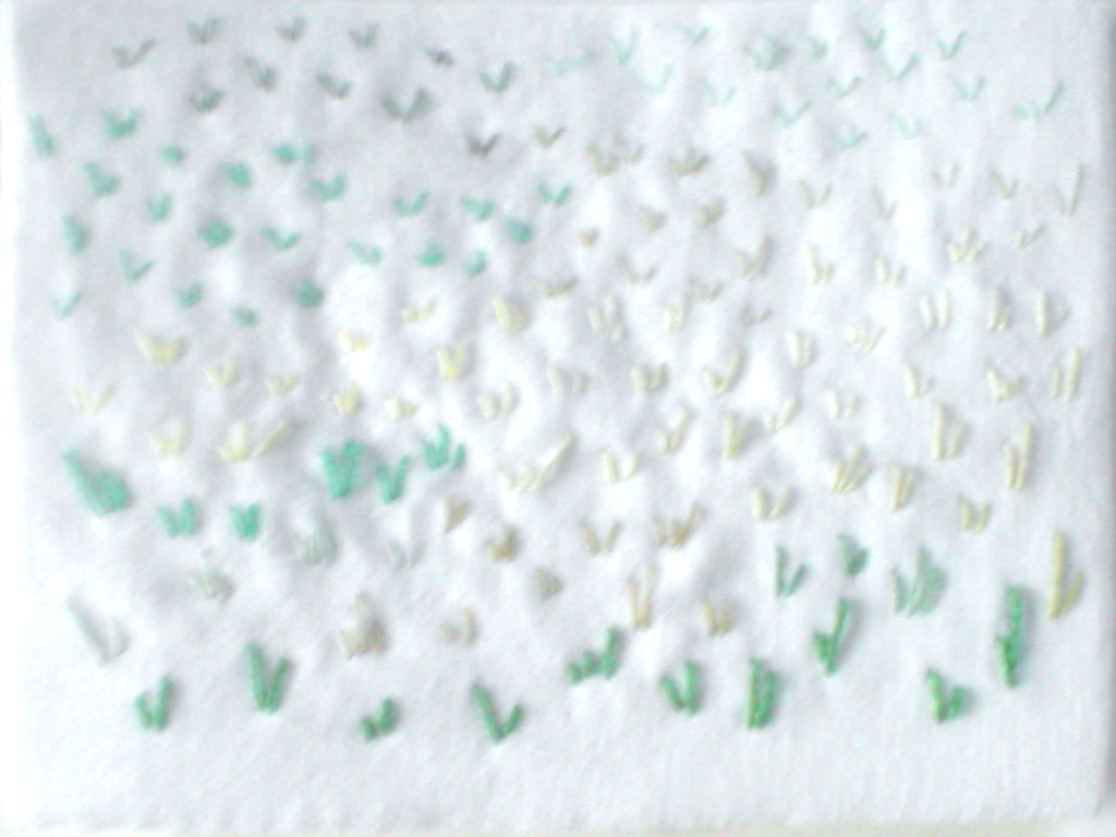 Green shoots arising from snow