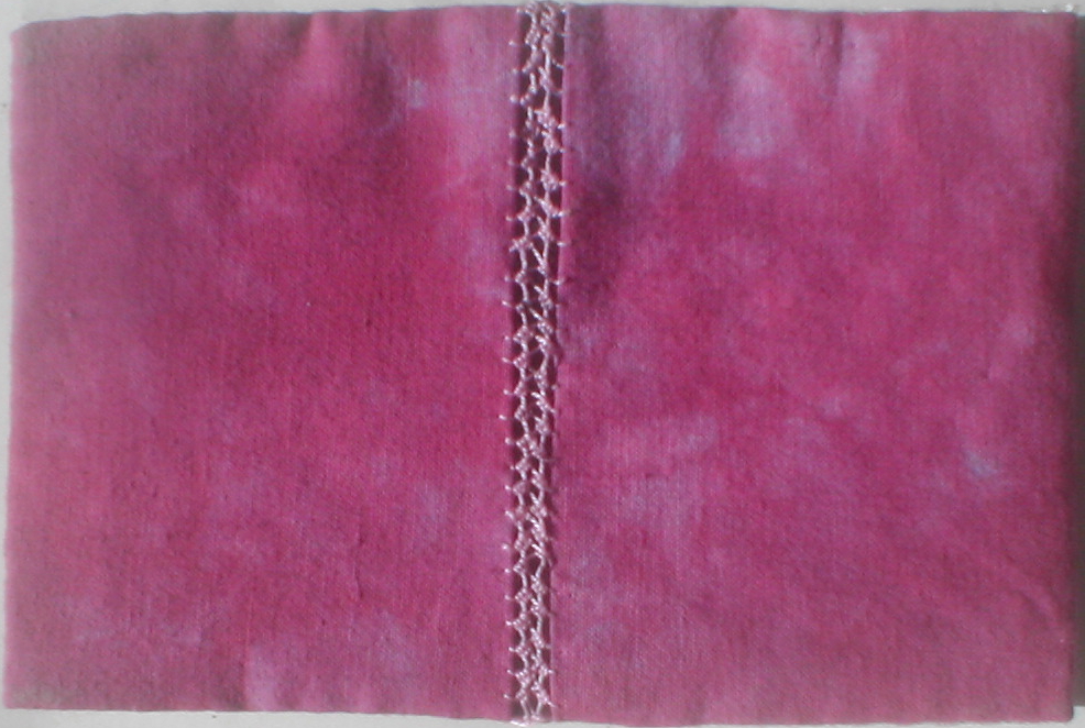 Pieces of fabric stitched together